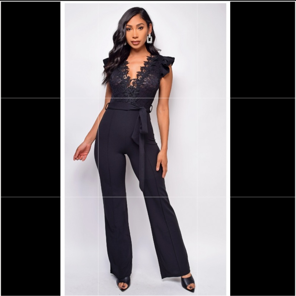 Brand new, never worn, tags on black jumpsuit.